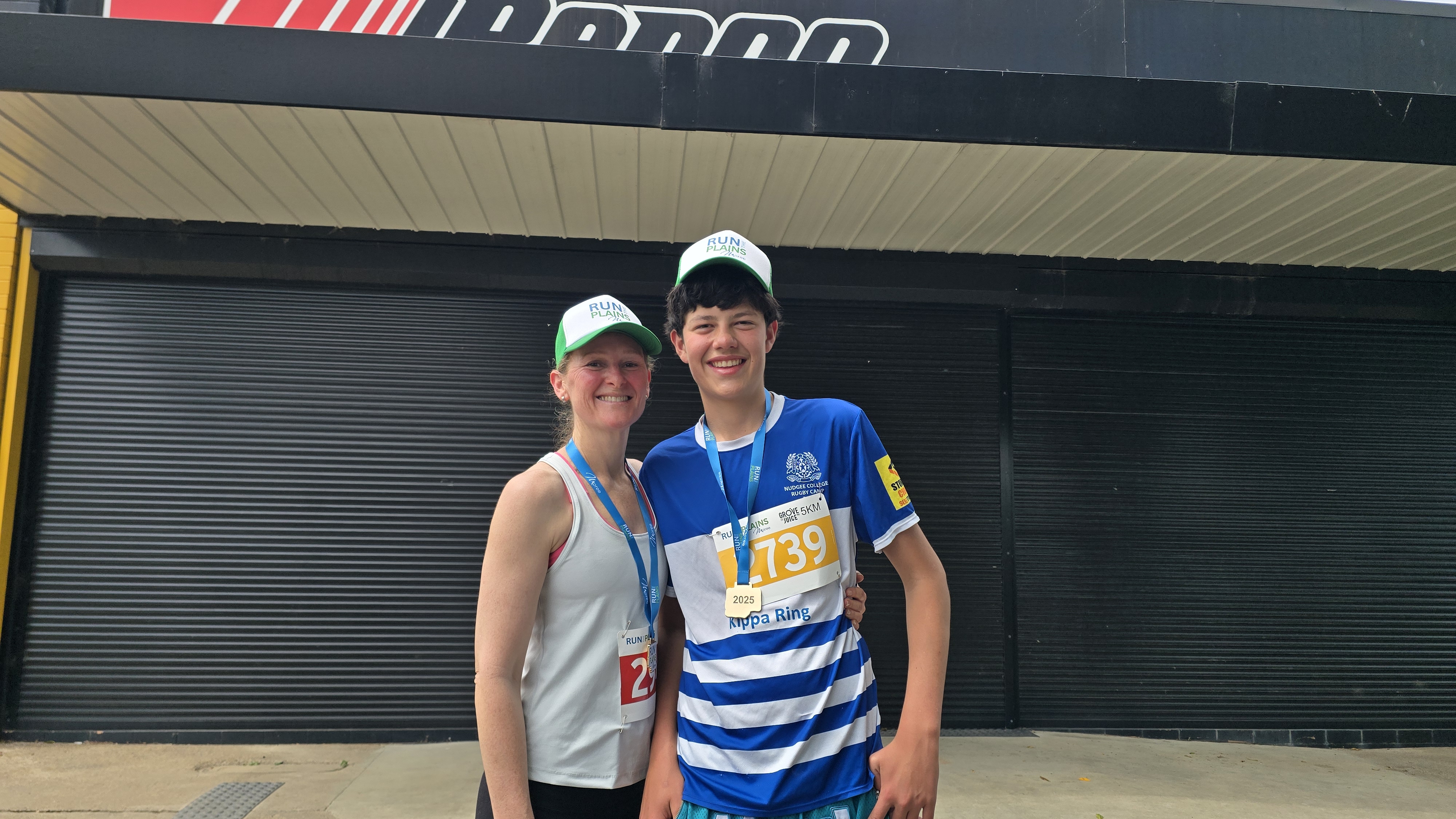 Jodie after a running event, wearing a finisher medal